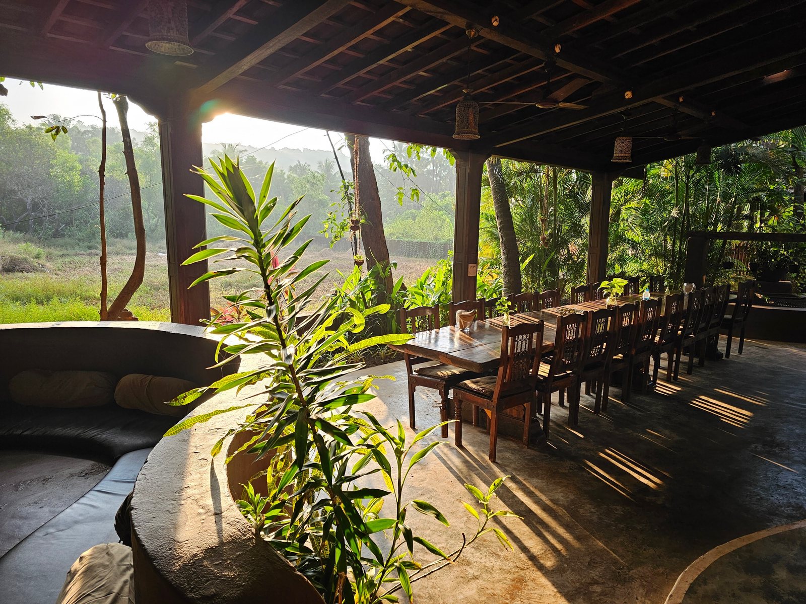 Long shared table under an open roof